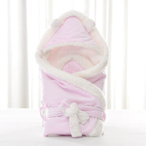 Newborn baby being hugged and swaddled by baby My Store