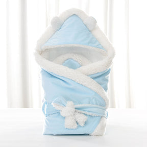 Newborn baby being hugged and swaddled by baby My Store