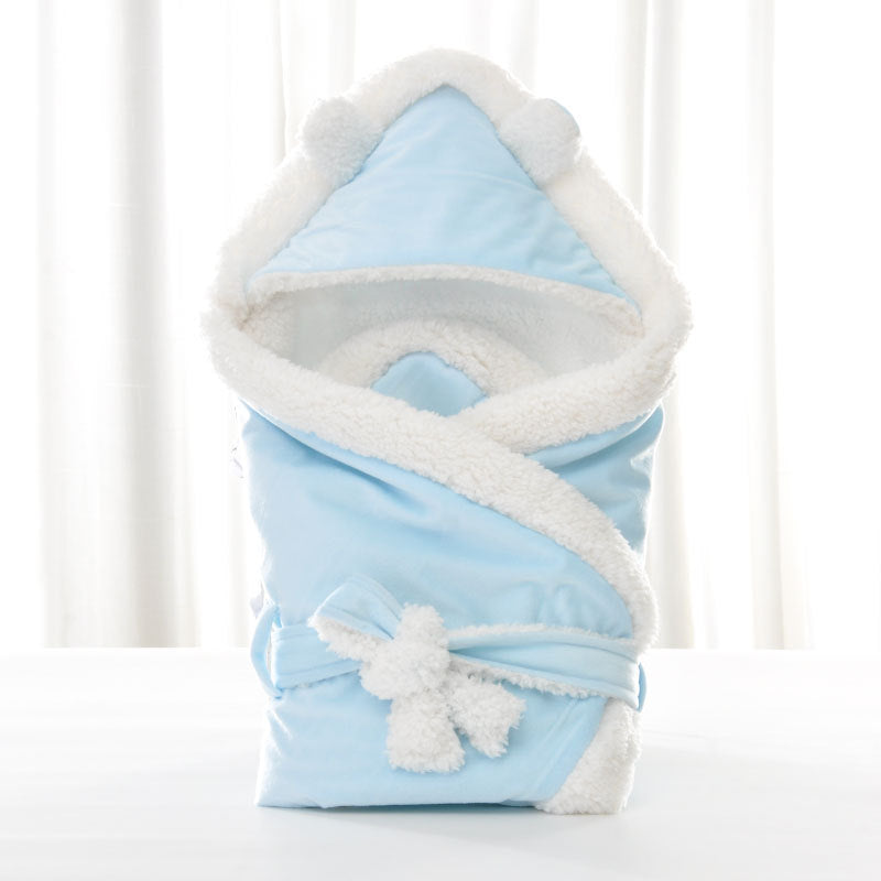 Newborn baby being hugged and swaddled by baby My Store